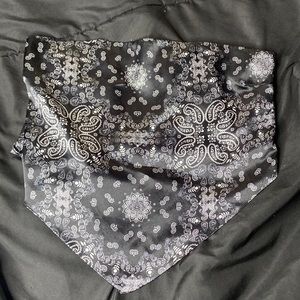 Black crop top with white print patters, not sure about the brand “large”